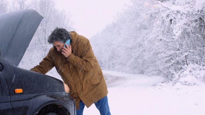 Man calling for help, engine issues on winter road