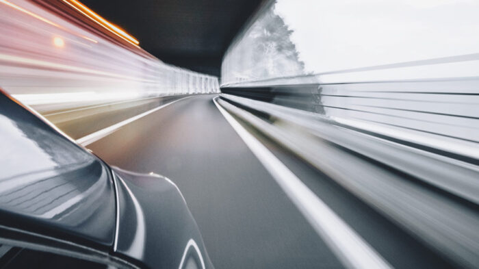 Car in a tunnel, blurred by speed