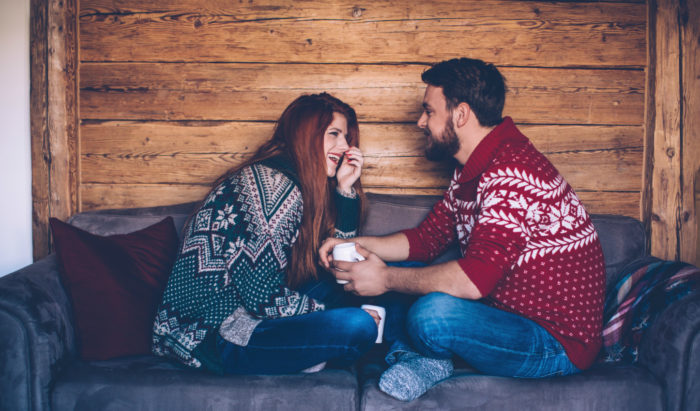 Couple smiling to each other in the cabin